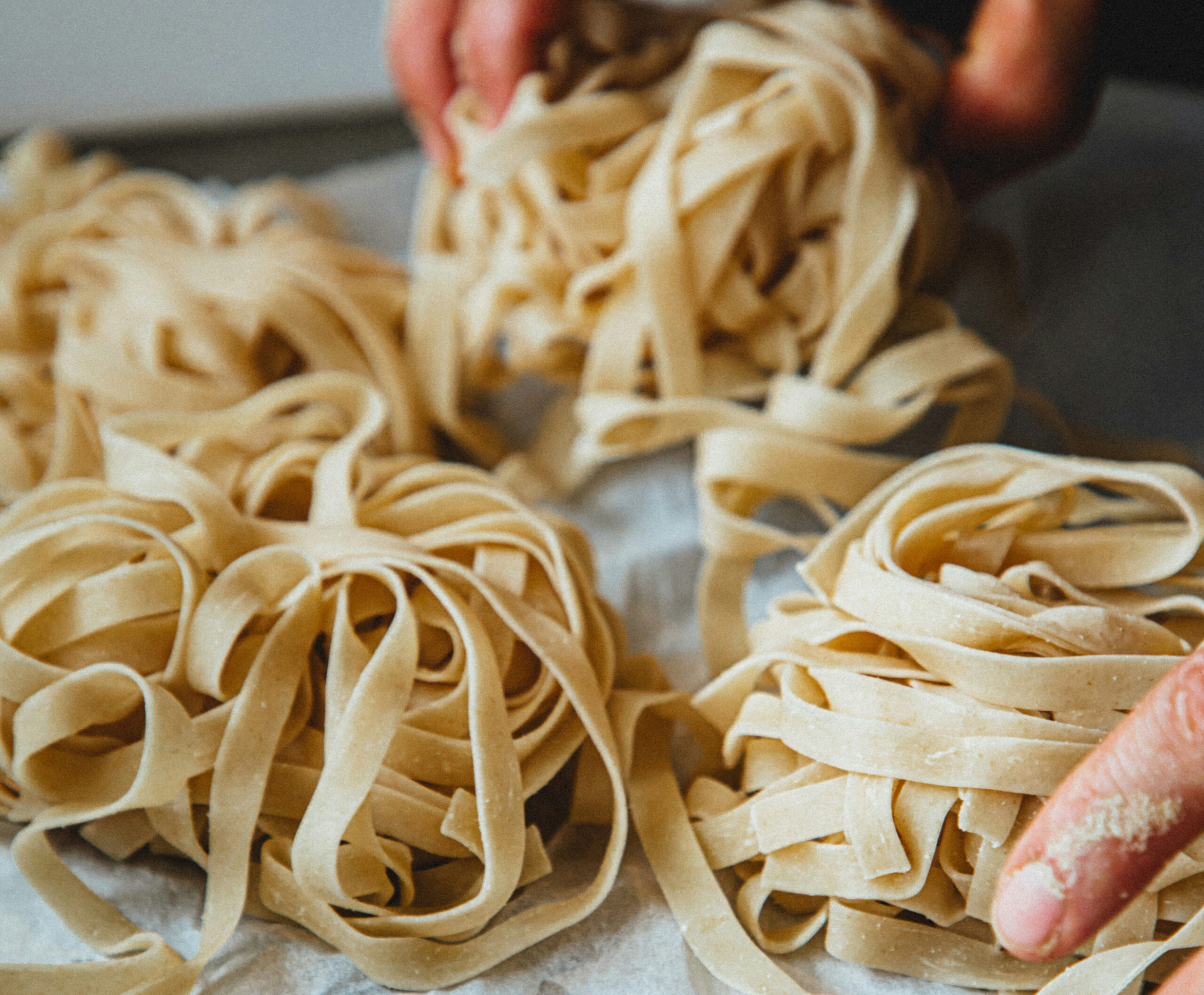 Close up of clumps of fresh pasta noodles