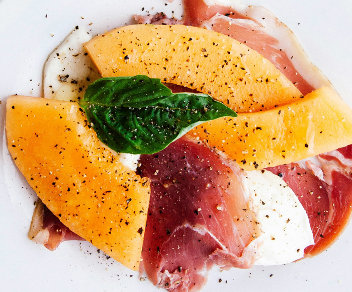 Close up of melon and prosciutto appetizer